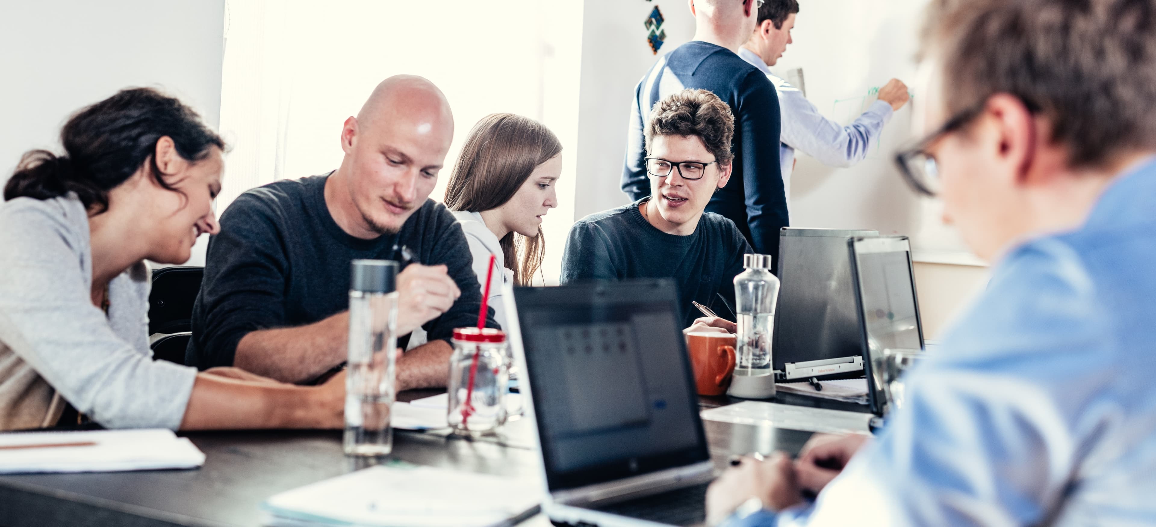 Growing team collaborating around a table